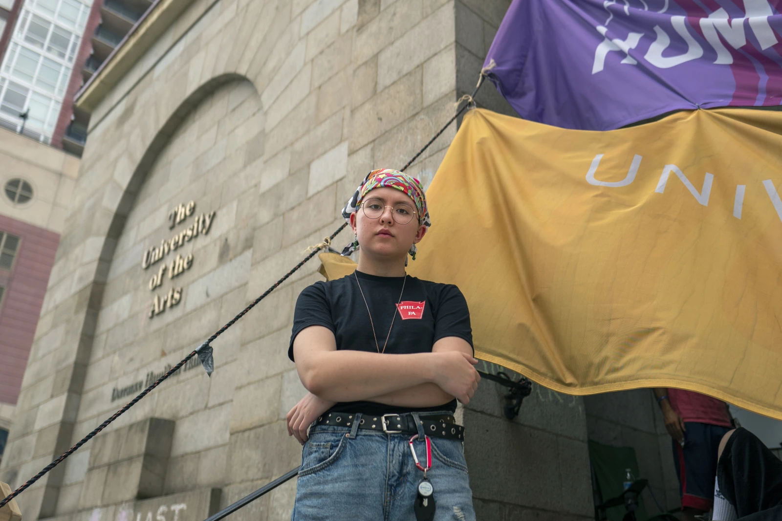 Rising sophomore Cyrus Nasib, 18, stands outside Dorrance Hamilton Hall at the University of the Arts, Friday, in Philadelphia. The closure of the university has left some 1,300 other students scrambling to find somewhere to go or something to do. (AP Photo/Joe Lamberti)
