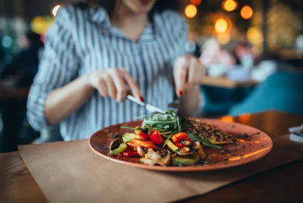 close up of woman in restaurant eatingclose up of woman in restaurant eating