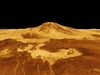 yellow mountains and surface of planet against black background 